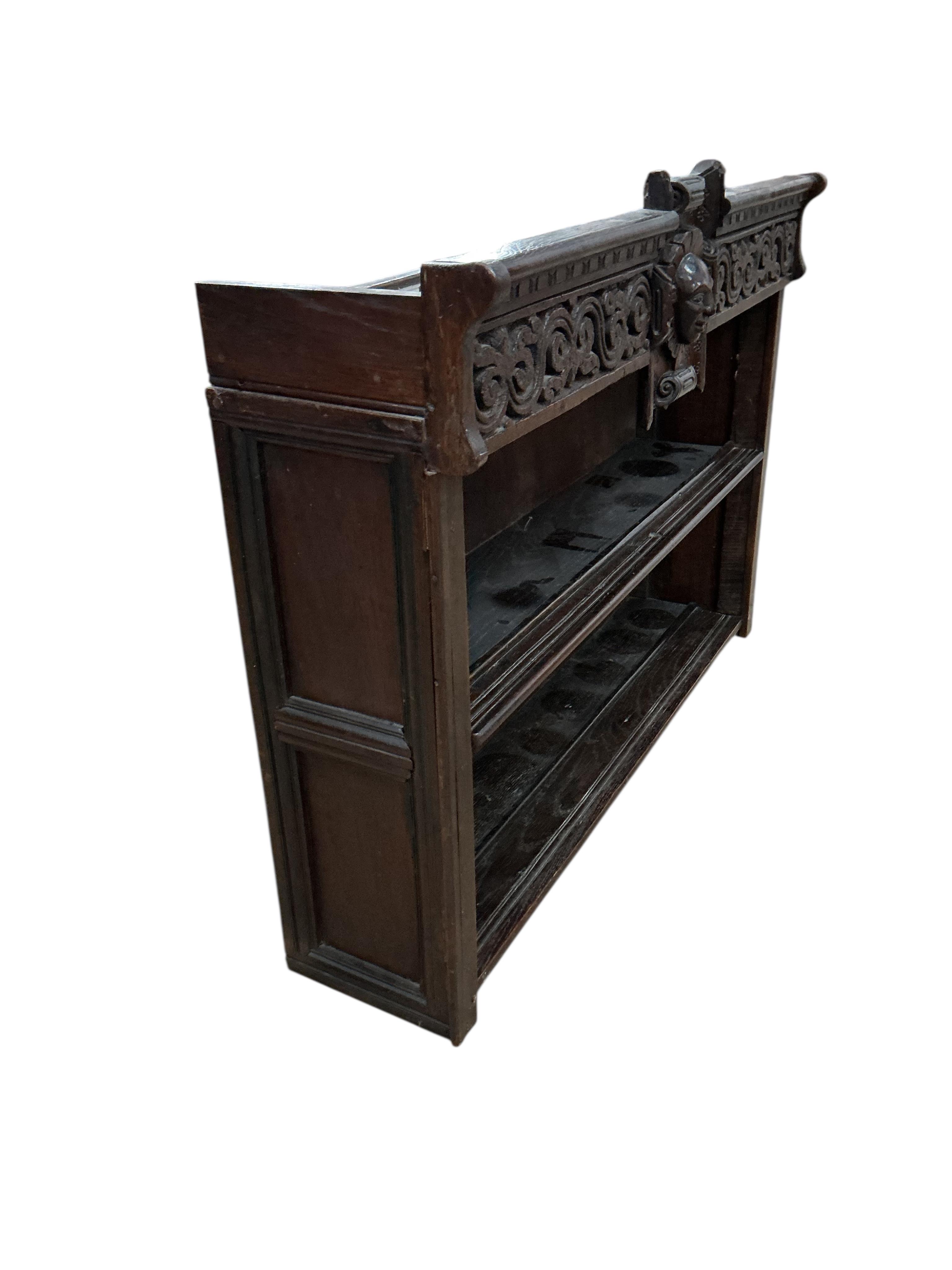 An 18th century style carved oak wall bracket, width 88cm, depth 22cm, height 66cm